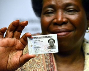 Home Affairs Minister with new smartcard ID