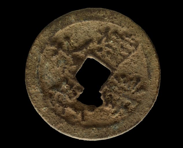The coin is made of copper and silver and has a square hole in the center so it could be worn on a belt. Scientists say it was issued by Emperor Yongle of China who reigned from 1403-1425 during the Ming Dynasty (AP Photo/Courtesy The Field Museum, John Weinstein)