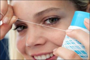 The E-Thread tag, shown here embedded in a spool of thread (RFID Journal)