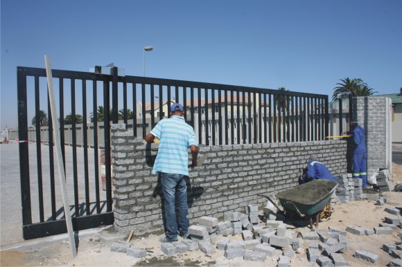 Workers putting the final touches to the entrance to the Botswana dry port. [Photo - Floris Stenkamp]
